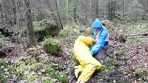 Raingear puppy with a friend outdoors